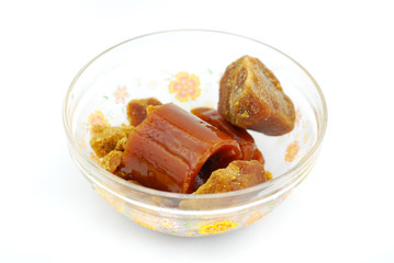 Palm sugar on white background