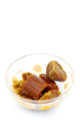 Palm sugar on white background