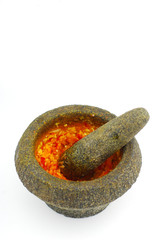 Spicy chili paste in a mortar stone
