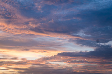 Naklejka na ściany i meble Sunset sky with curve cloud in blue and yellow color