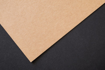 Kraft paper sheet overlap with brown and black colors for background, banner, presentation template.
