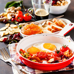 Breakfast including coffee, fried egg , becon. nut , muesli and bread . Selective focus