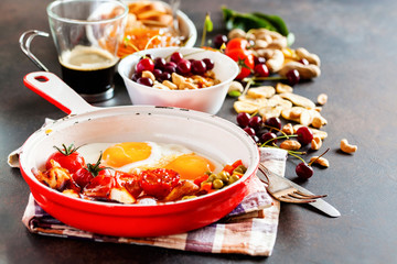 Breakfast including coffee, fried egg , becon. nut , muesli and bread . Selective focus