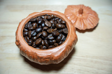 dried figs in a pumpkin bowl on wooden table