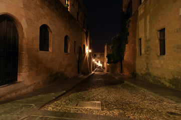 Medieval Avenue of the Knights at night, a cobblestone street in Rhodes Citadel , Greece