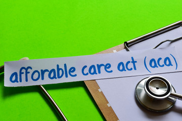 Affordable care act (ACA) on Healthcare concept with green background