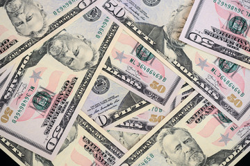 Fototapeta na wymiar USD fifty dollar bills background close up