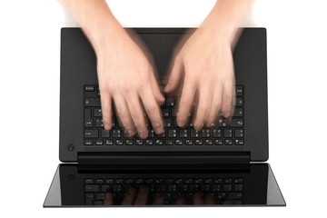 Fototapeta na wymiar Fast typing fingers on notebook
