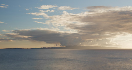 Sunlight ray though the cloud and sea under sunset