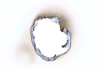 Hole burnt in a sheet of paper
