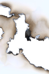 Burnt through blank sheet of a paper