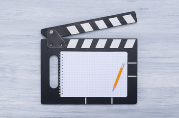 movie movie for filming, with space for inscriptions and a pencil on a white sheet