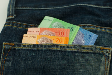 Malaysia Ringgit money in denim pocket