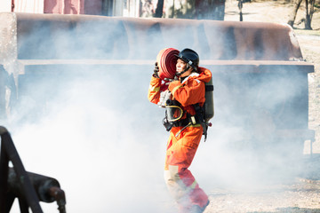 Firefighter are using fire hose coil / Fire and rescue training school regularly to get ready - Help, Fire Protection Concept