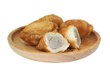 Curry puff stuffed coconut in wood plate isolated on whote background with clipping path..