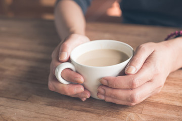woman hold a cup a coffee