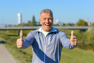 Enthusiastic motivated man giving a thumbs up