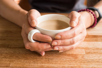 woman hold a cup a coffee