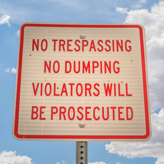 No trespassing and no dumping sign close up
