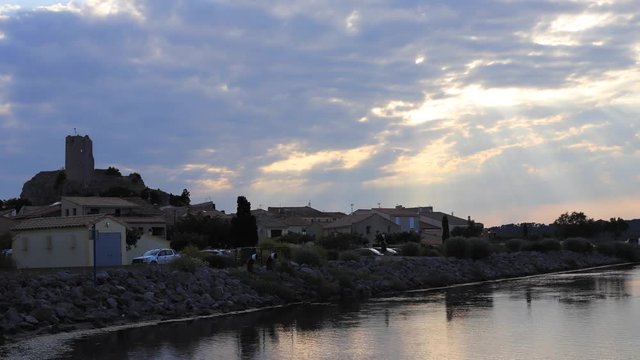 time lapse of mediterranean village of Guissan and marine pond at sunset  , Aude in the south of France
