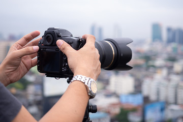Photographer handling digital camera