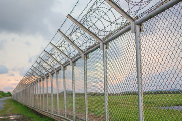 wire mesh steel with green grass background in Phuket Thailand