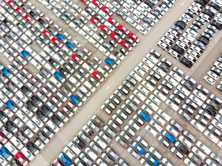 Aerial top view photo from flying drone, New Cars produced Several times a year at industrial...