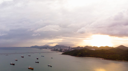 Aerial view of sea freight at sun rise, Crude oil tanker lpg ngv at industrial estate Thailand / Crude Oil tanker to Port of Singapore - import export around in the world