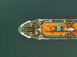 Aerial Top View of sea freight, Crude oil tanker lpg ngv at industrial estate Thailand / Crude Oil tanker to Port of Singapore - import export around in the world