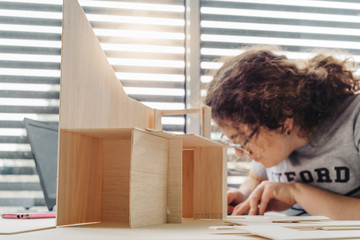A Woman architecture student working on models