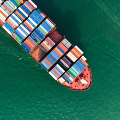 Fototapeta na wymiar Aerial view of sea freight, Cargo ship, Cargo container in factory harbor at industrial estate for import export around in the world, Trade Port / Shipping - cargo to harbor