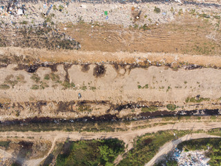 Aerial top view photo from flying drone of large garbage pile, degraded garbage. Pile of stink and...