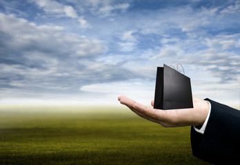 Shopping concept, Businessman carry shopping bag in hand