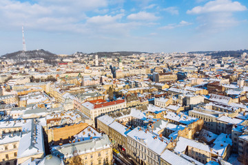 Obraz premium bird's eye view of old european city in winter day on sunset