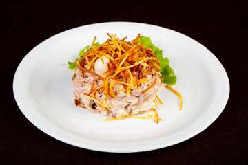 Russian salad with fried potato