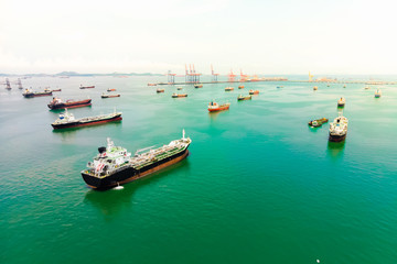 Naklejka premium Aerial view of sea freight, Crude oil tanker lpg ngv at industrial estate Thailand / Crude Oil tanker to Port of Singapore - import export around in the world