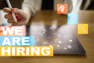 We are hiring text on virtual screen. Recruitment. HR. Human resources management. Business concept.