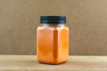Cheese powder on wooden background