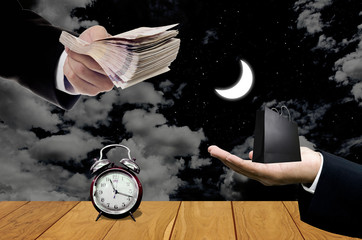 Shopping at night concept, Businessman carry cash for pay