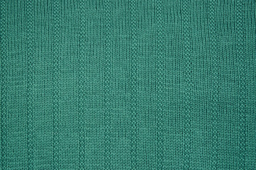 Fototapeta premium Bluish-green knitted texture.