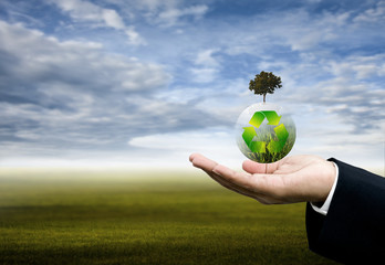 Recycle global plant flying over hand, Sustanable concept