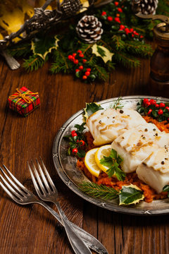 Christmas fish. Roasted cod pieces, served in vegetable sauce.