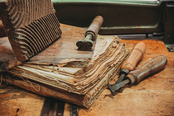 Restoration laboratory Ancient books surrounded by tools and equipment.