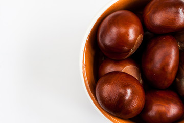 Bowl with autumn chestnuts.