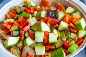 Vegetable stew cooked in a large frying pan, close-up, top view