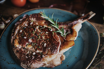 Tomahawk on a plate with garnish food photography recipe idea