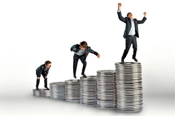 small copies of a businessman climb up the steps. concept - leadership in the financial sector