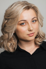 Fototapeta premium Portrait of young Caucasian blonde girl with Nude makeup with clean skin