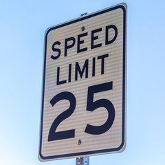 Speed limit road sign against a blue sky