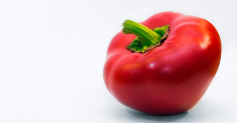 Red bell pepper on a light gray background. Spicy sweet taste. Summer vegetables. Bright juicy...